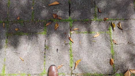 Man-in-shoe-on-the-concrete-floor