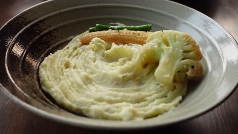 Mashed-potatoes-in-bowl-on-wooden-rustic-table