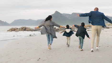 Playful,-beach-and-family-running-together