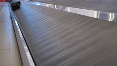 Luggage-moving-on-conveyer-belt