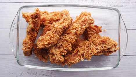 Fried-chicken-fillets-on-plate-on-blue-background
