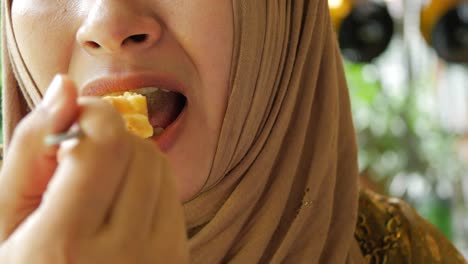 Women-eating-lemon-tart-close-up-,