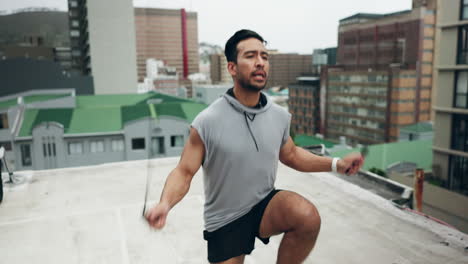 Asian-man,-fitness-and-jumping-rope-on-rooftop