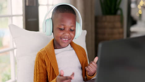Headphones,-laptop-and-boy-child-doing-math
