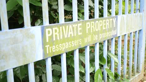 Private-property-no-trespassing-text-and-buildings-,