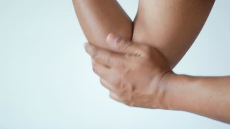 Man-with-elbow-pain-pain-relief-concept