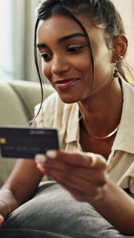 Woman,-credit-card-and-laptop-on-sofa-for-online