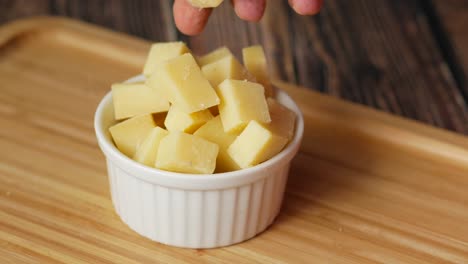 Close-up-of-cube-shape-fresh-cheese-on-in-a-bowl