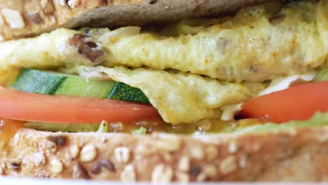 Egg-sandwich-and-chips-on-plate-close-up