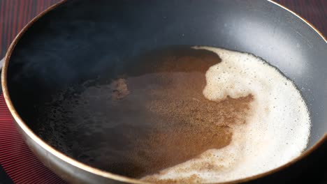 Pouring-vegetable-oil-into-frying-pan
