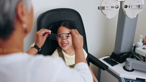 Optometrist,-child-and-frame-for-glasses
