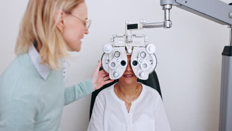 Eye-exam,-women-and-optometrist-talking