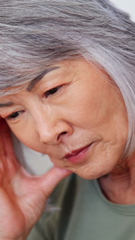 Senior-woman,-stress-and-headache