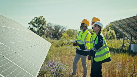 Teamwork,-solar-panel-and-installation-on-field