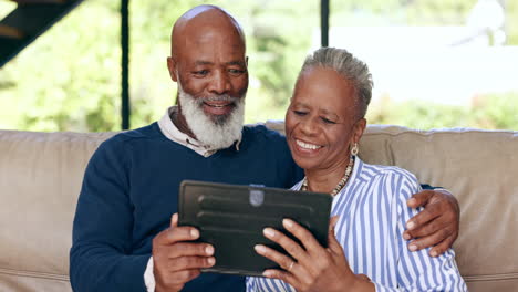 Home,-senior-couple-and-funny-with-tablet