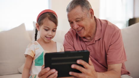 Happy,-tablet-and-grandfather-with-child-on-sofa