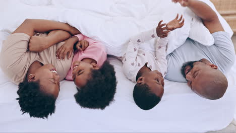 Love,-top-view-and-happy-black-family-in-a-bed