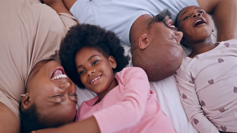Smile,-relaxing-and-black-family-having-fun-in-bed