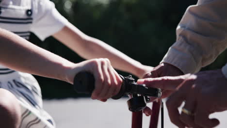 Closeup,-hands-and-people-with-bicycle-in-street