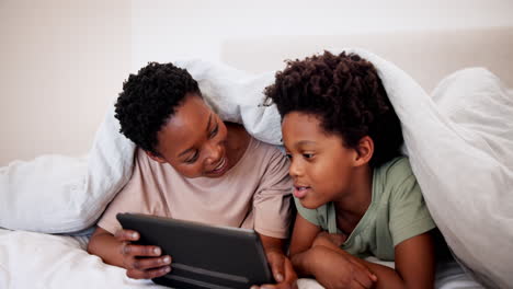 Mother,-talk-and-kid-on-tablet-in-bedroom