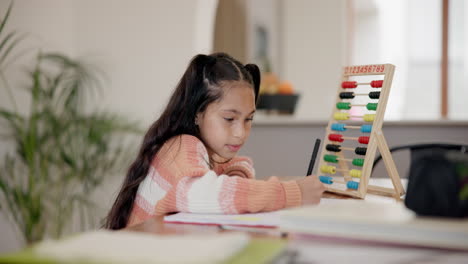 Girl,-child-and-writing-in-book-with-abacus