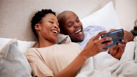 Home,-bed-and-black-couple-with-a-smartphone
