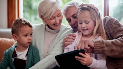 Happy,-tablet-and-children-with-grandparents