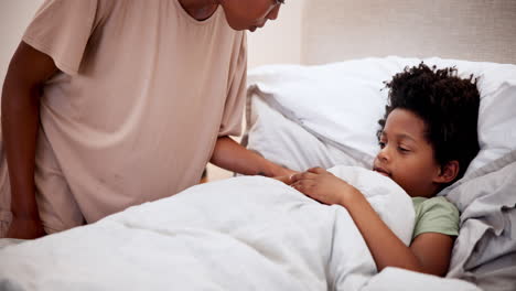 Woman,-monitor-and-sick-child-in-bed-with-cough