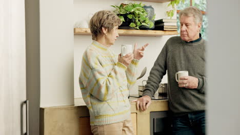 Senior-couple,-coffee-and-talking-in-kitchen