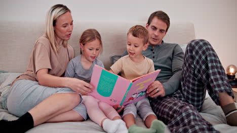 Parents,-kids-and-reading-books-in-bedroom