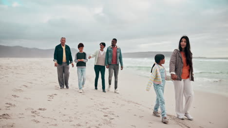 Big-family,-holding-hands-and-beach-walking