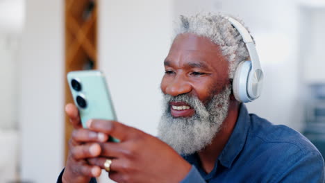 Senior-man,-smartphone-and-happy-with-headphones