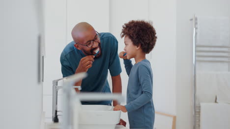 Child,-learning-and-brushing-teeth-with-dad