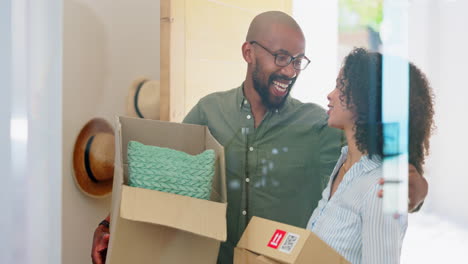 Happy-couple,-moving-and-hug-with-boxes-in-home