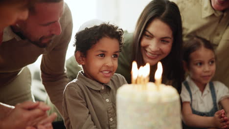 Child,-candles-and-blow-at-birthday-cake