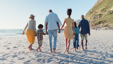 Beach,-back-and-big-family-holding-hands