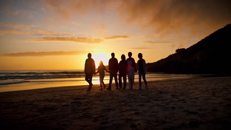 Sunset,-love-and-silhouette-of-family-at-the-beach