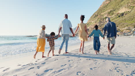 Beach,-big-family-and-holding-hands-while-walking