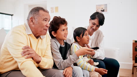 Family,-children-and-grandparents-watching-tv