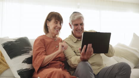 Tablet,-wave-and-video-call-with-a-senior-couple