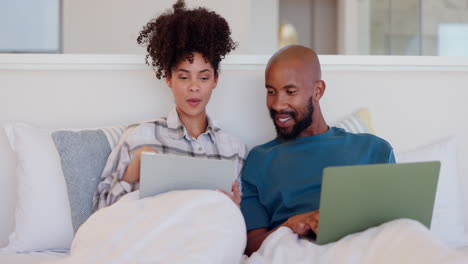 Bedroom,-conversation-and-couple-with-a-laptop