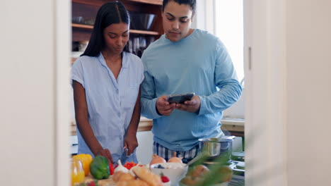 Love,-cooking-and-couple-with-phone-in-the-kitchen