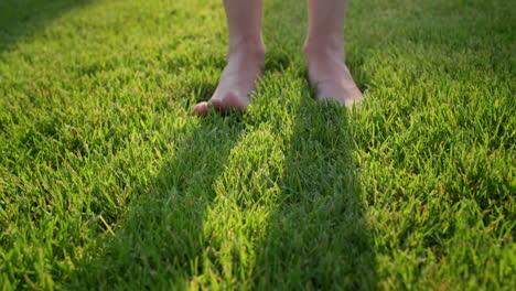 Women's-feet-barefoot-in-the-gentle-green-grass