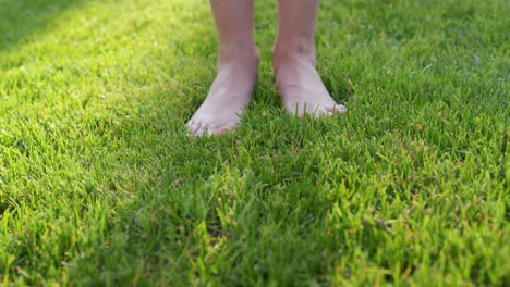 Women's-feet-barefoot-in-the-gentle-green-grass