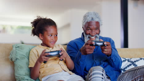 Child,-grandfather-and-video-games-for-play