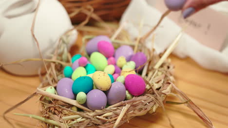 Easter,-hand-and-decoration-with-egg-for-holiday