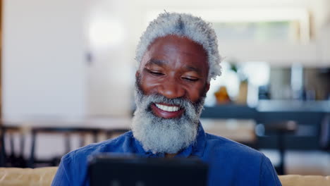 Senior-man,-tablet-and-laugh-in-home-for-reading