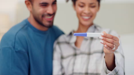 Couple,-hands-and-pregnancy-test-for-positive