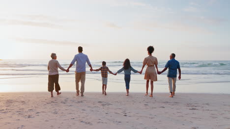 Back,-holding-hands-and-family-with-sunset