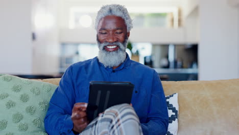 Senior-man,-tablet-and-smile-on-sofa